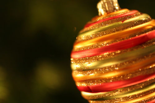 striped christmas ball or bauble decoration free christmas background